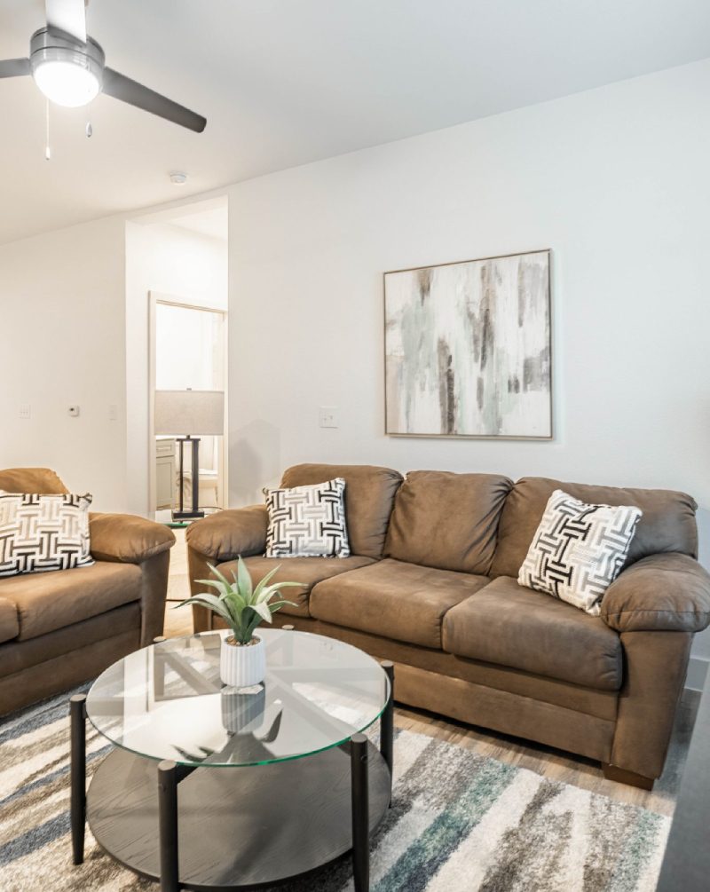 Modern furnished corporate apartment living area.